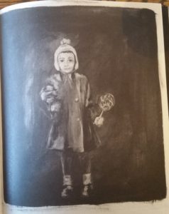 A little girl with her lolipop and her Paddington Bear.